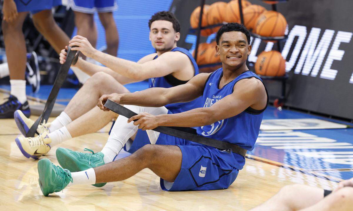 Duke’s Caleb Foster laughs while stretching before the Blue Devils’ practice at Capital One Arena in Washington, D.C., Thursday, March 26, 2026. The Blue Devils face St. John’s in the Sweet 16 of the NCAA Men’s Basketball East Regional Friday.