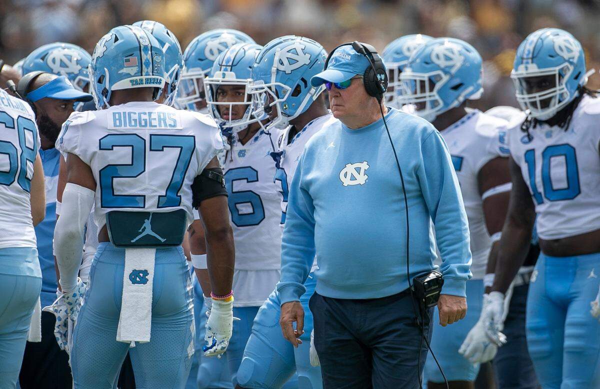 North Carolina coach Mack Brown huddles with his defensive unit in the first quarter against Appalachian State on Saturday, September 3, 2022 at Kidd Brewer Stadium in Boone, N.C.