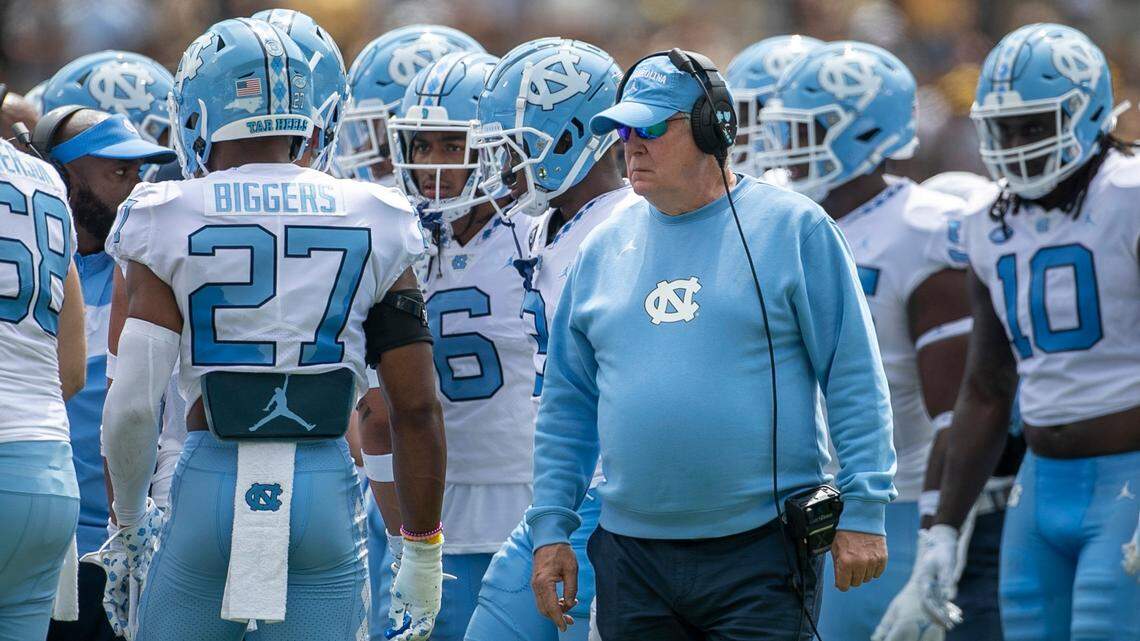 North Carolina coach Mack Brown huddles with his defensive unit in the first quarter against Appalachian State on Saturday, September 3, 2022 at Kidd Brewer Stadium in Boone, N.C.