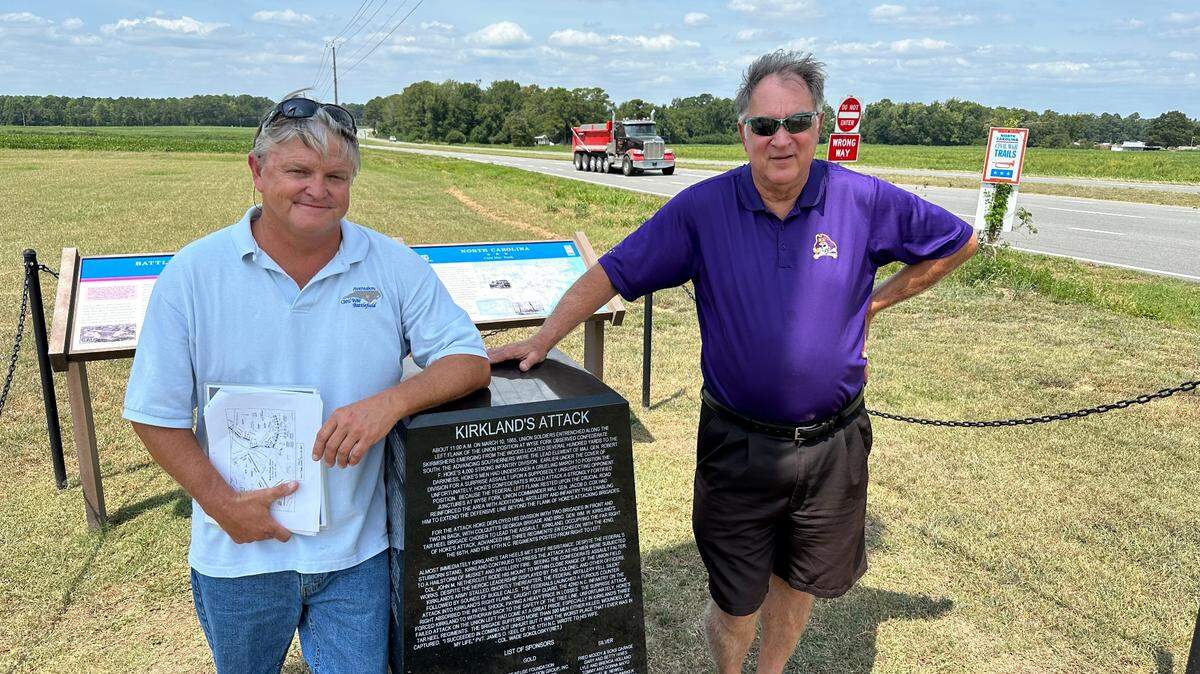 Wade Sokolosky, left, and Dennis Harper stand next to a monument to commemorate Confederate Brig. Gen. William Kirkland’s attack on Union lines during the fourth and final day of the Battle of Wyse Fork outside Kinston. The monument, which Sokolosky and Harper helped erect, will have to be moved when the N.C. Department of Transportation turns U.S. 70 into an interstate highway in coming years.