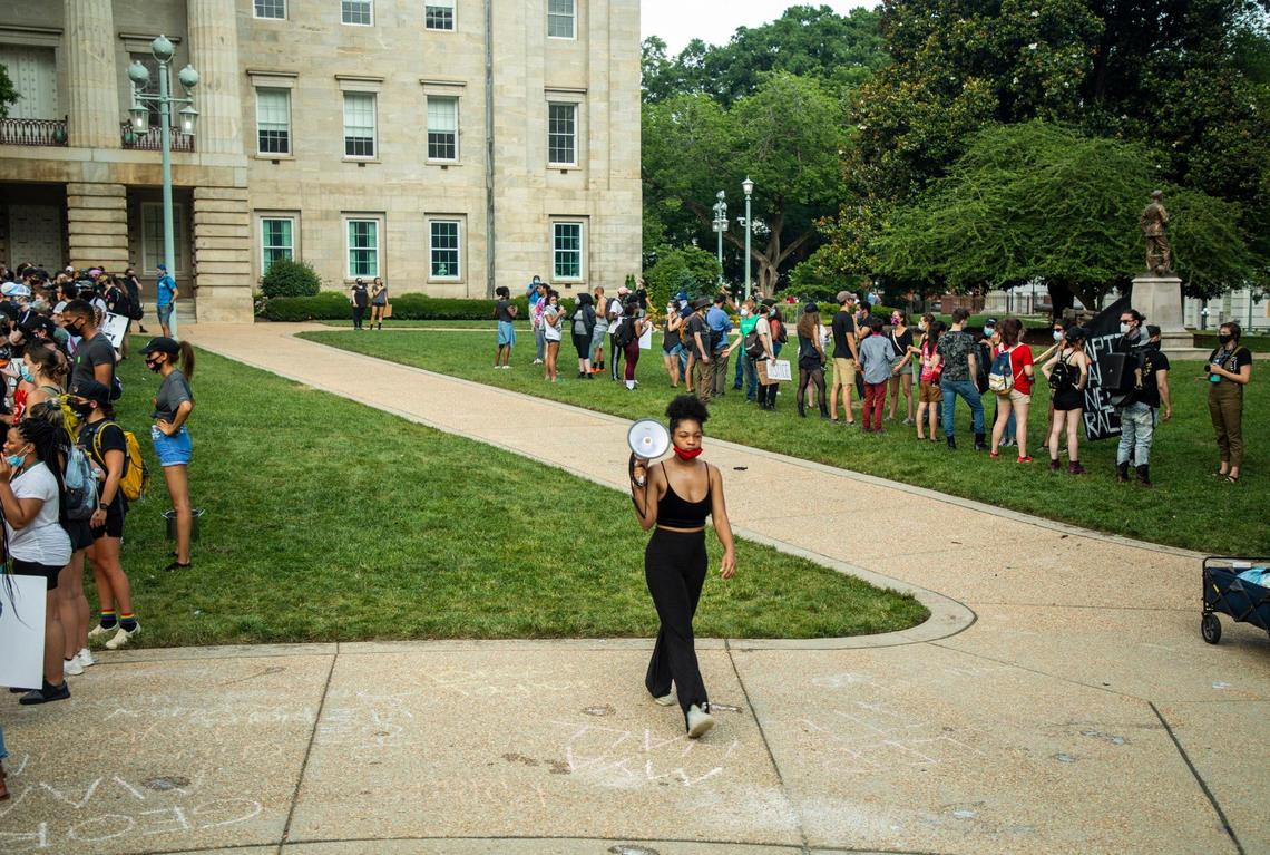 Lauren Howell leads protesters gathered on the Capitol grounds in an exercise to share their personal experiences one on one, on the 11th day of protests ignited by the death of George Floyd under the knee of a Minneapolis police officer and since evolved address a wide range of issues in the Black Lives Matter movement, resulting in reforms adopted by the Raleigh Police Department and a task force formed by Gov. Roy Cooper, on Wednesday, Jun. 10, 2020, in Raleigh, N.C.
