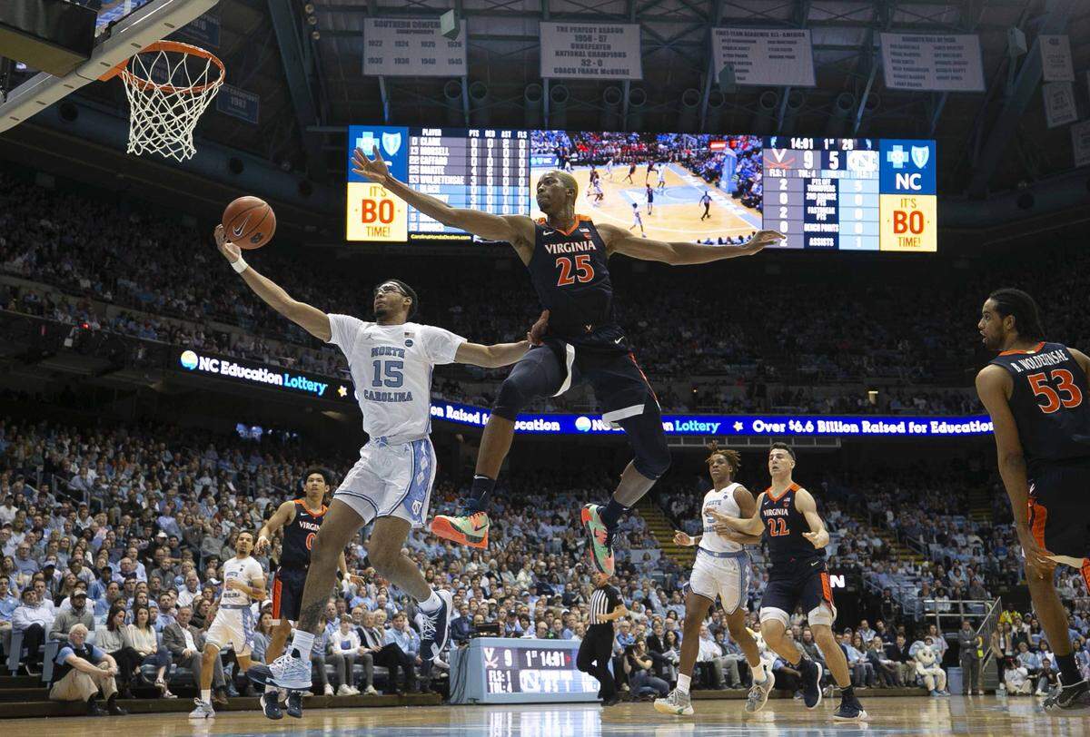 North Carolina’s Garrison Brooks (15) drives to the basket against Virginia’s Mamadi Diakite (25) during the first half on Saturday, February 15, 2020 at the Smith Center in Chapel Hill, N.C.