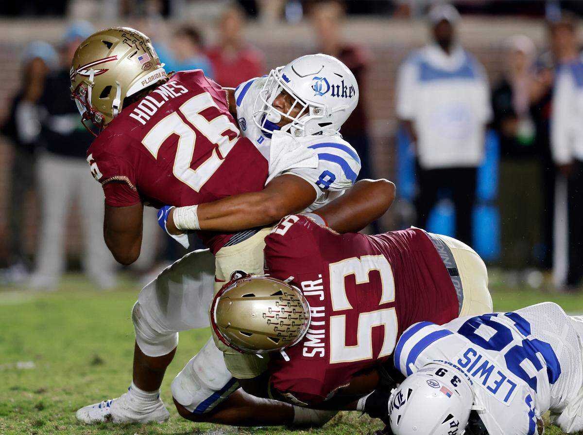 Duke’s Dorian Mausi (8) tackles Florida State’s Caziah Holmes during the second half of the Blue Devils’ 38-20 loss on Saturday, Oct. 21, 2023, in Tallahassee, Fla.