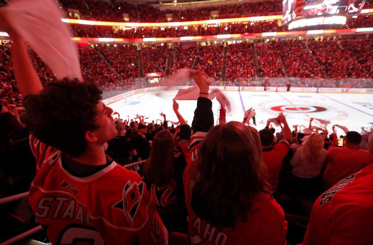 Canes fans cheer on the team before the first period of the Carolina Hurricanes’ game against the Boston Bruins in game four of the Eastern Conference finals at PNC Arena in Raleigh, N.C. Thursday, May 16, 2019.