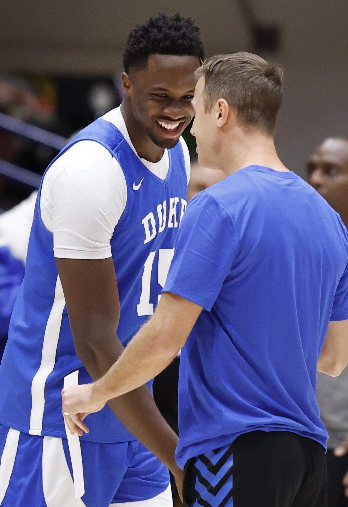 Duke’s Ifeanyi Ufochukwu (15) laughs with head coach Jon Scheyer during the Blue Devils’ open practice at Cameron Indoor Stadium in Durham, N.C., Tuesday, August 5, 2025.