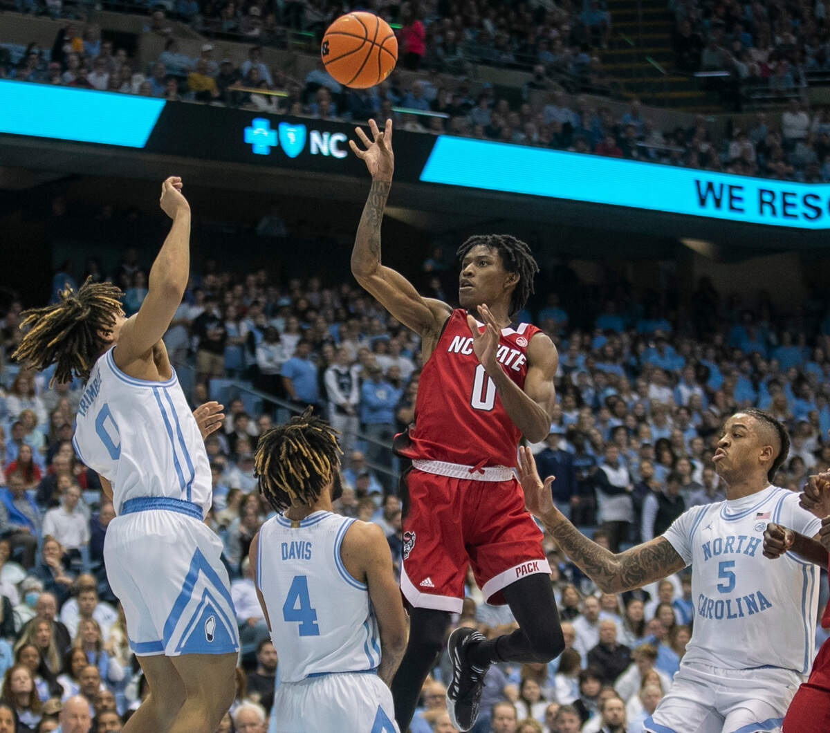N.C. State’s Terquavion Smith (0) puts up a shot against North Carolina’s Seth Trimble (0) during the first half on Saturday, January 21, 2023 at the Smith Center in Chapel Hill, N.C.