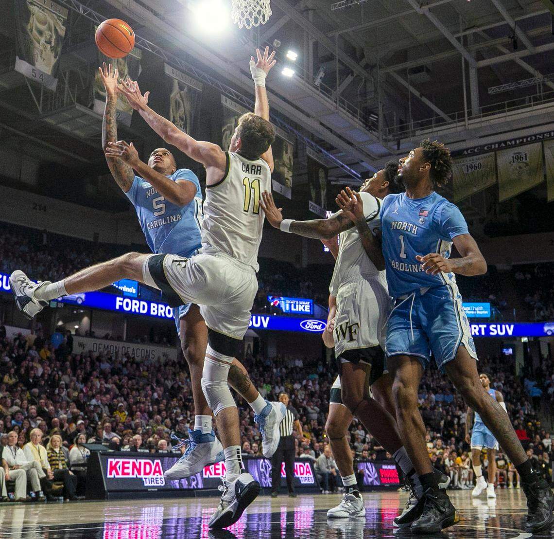 North Carolina’s Armando Bacot (5) puts up a shot against Wake Forest’s Andrew Carr (11) in the second half on Tuesday, February 7, 2023 at Lawrence Joel Coliseum in Winston-Salem, N.C. Bacot scored 17 points.
