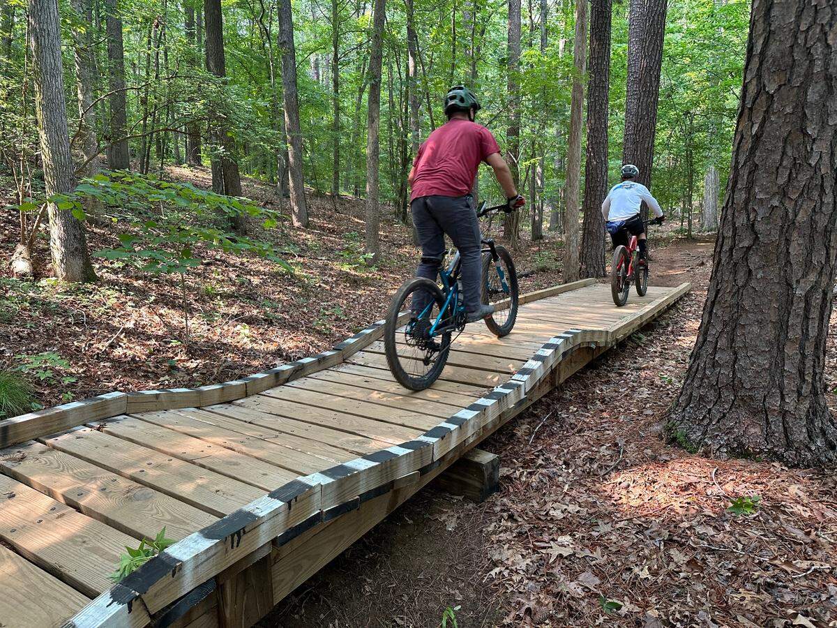 Members of TORC, Triangle Off-Road Cyclists, built many bridges and jumps like this one in Lake Crabtree County Park.