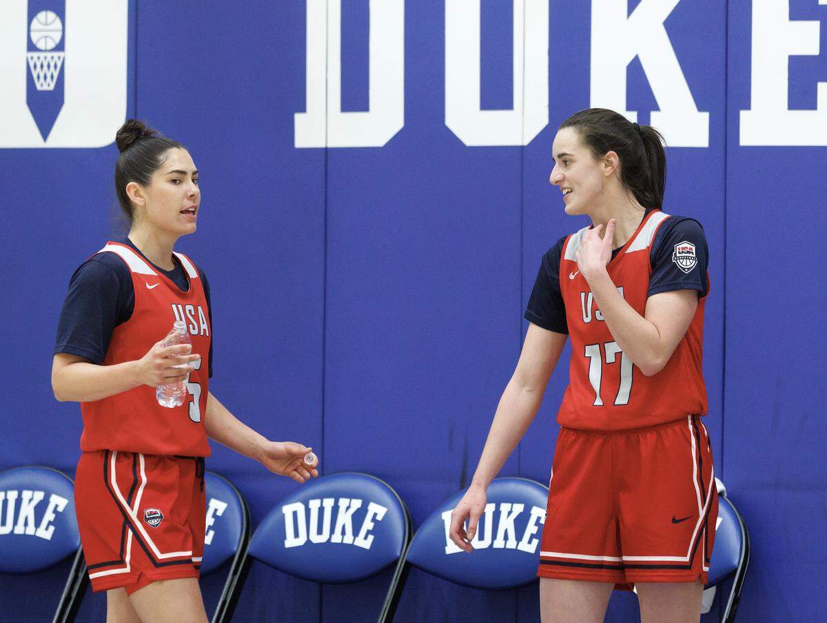 Kelsey Plum talks with Caitlin Clark during USA Basketball Women’s National Team training camp on Friday, Dec. 12, 2025, in Durham, N.C.