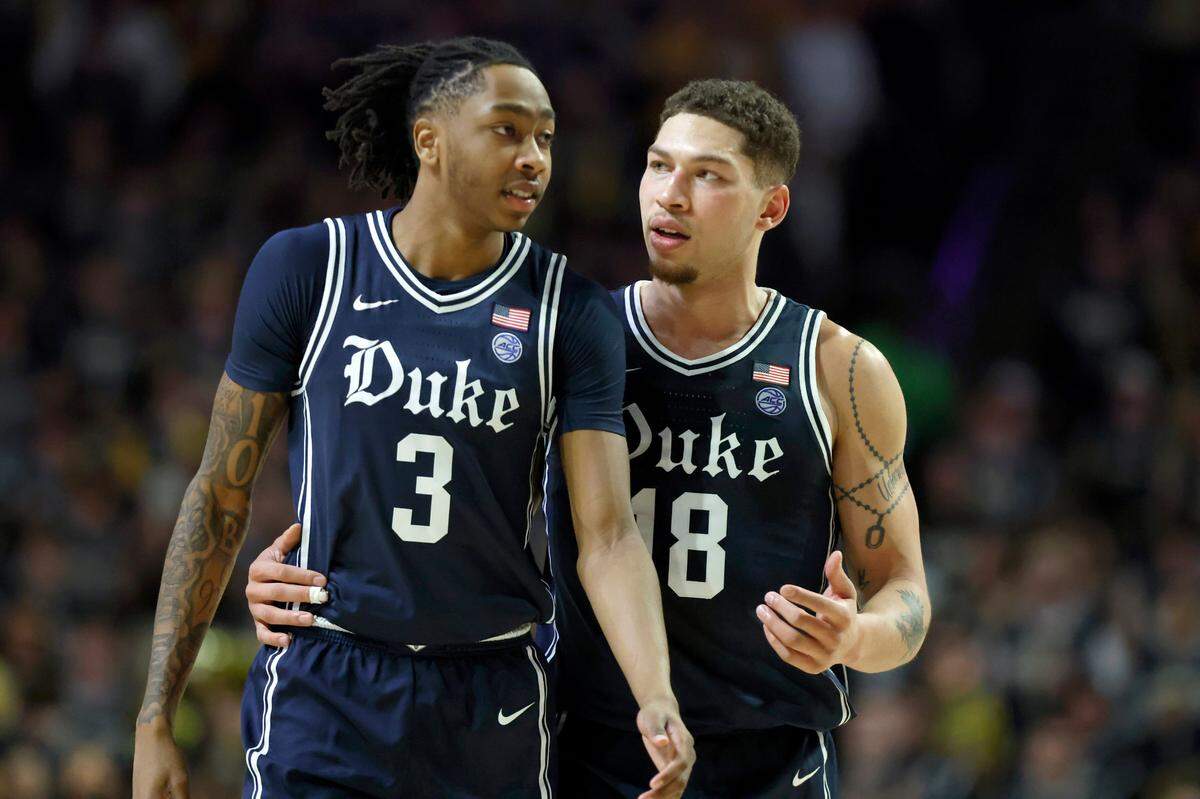 Duke’s Mason Gillis (18) talks with Isaiah Evans (3) during the first half of Duke’s game against Wake Forest at LJVM Coliseum in Winston-Salem, N.C., Saturday, Jan. 25, 2025.