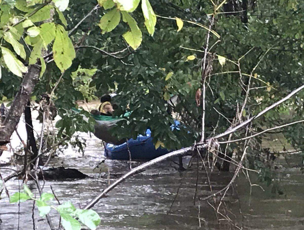 The Asheville Fire Department used a ladder truck and a boat to rescue two people trapped in a hammock over a swollen river during Tropical Storm Michael on Thursday, Oct. 11, 2018.
