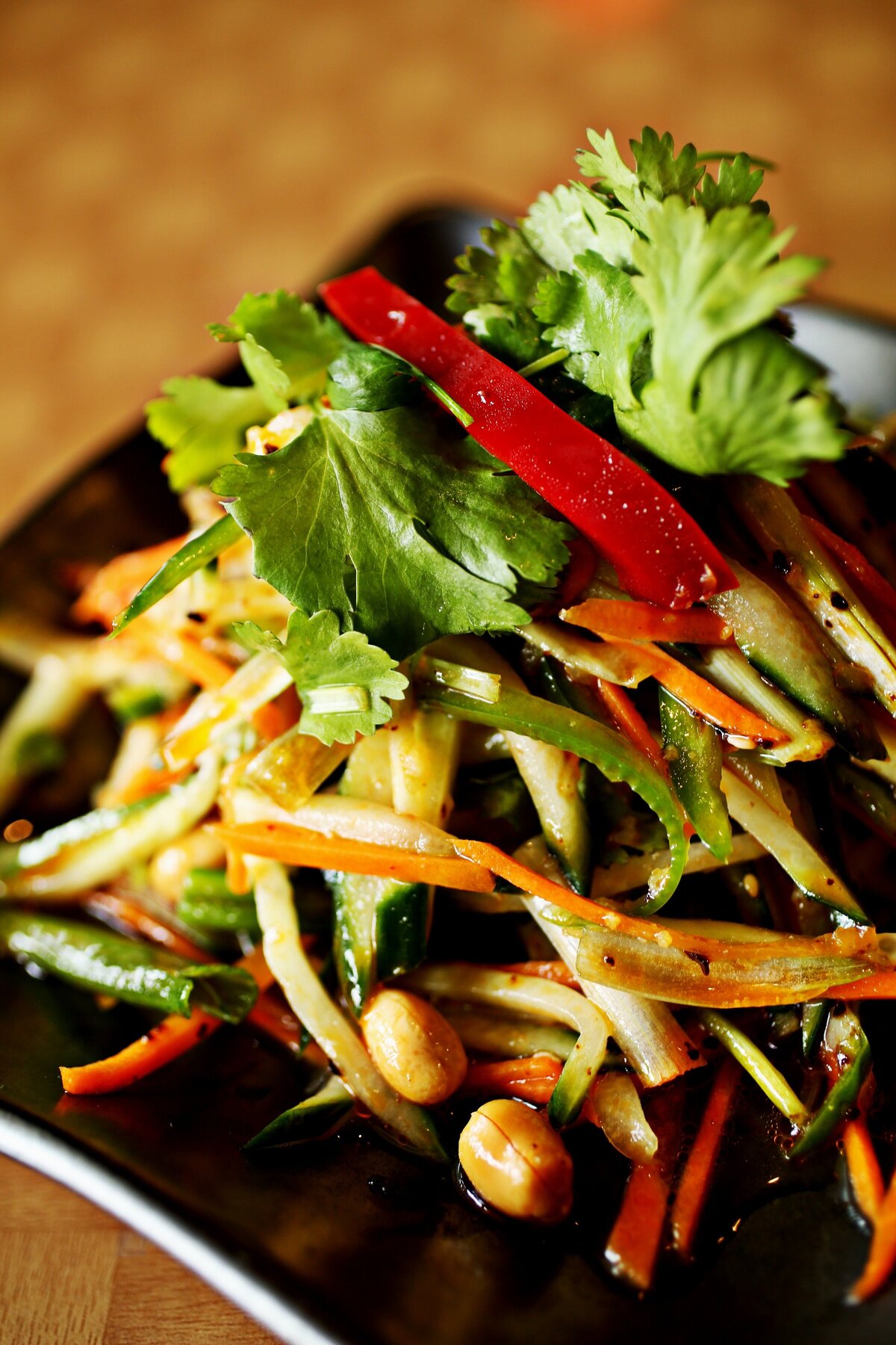 The mysteriously named “five vegetable mixed,” one of a mere handful of items in the list of authentic appetizers at Nice Bowls Asian Cuisine in Cary, turns out to be abright, crunchy medley of julienne carrot, cucumber, scallion, peanuts and cilantro, glistening in a sheen of chile oil and served cold.