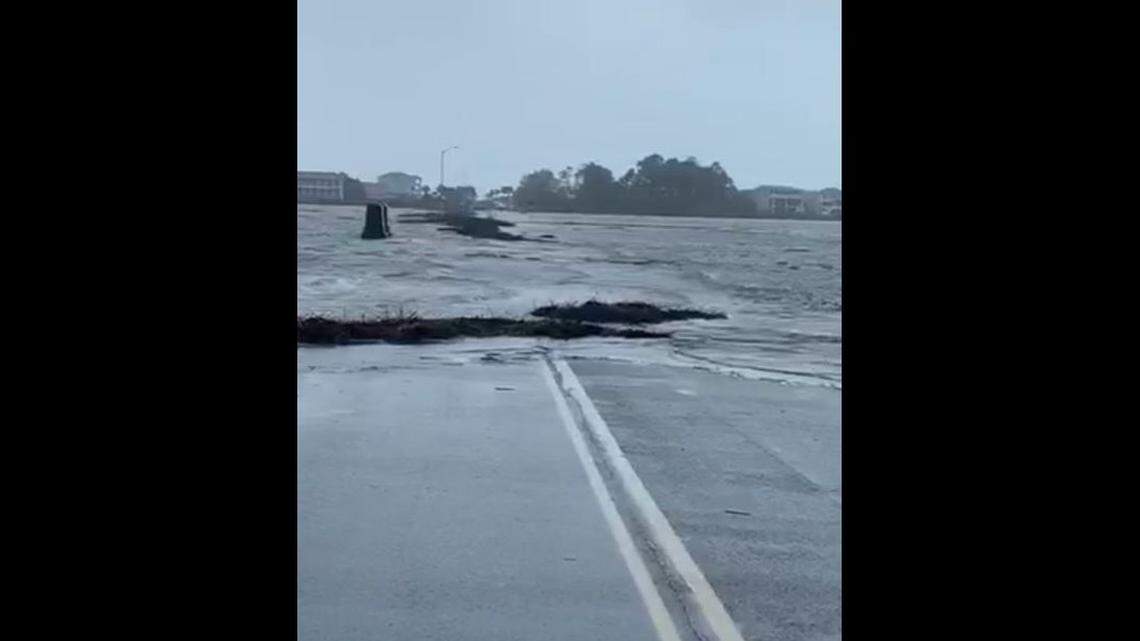 Island causeway floods minutes after being closed for Hurricane Ian, NC video shows