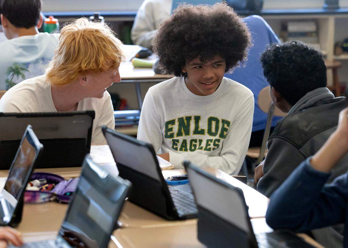 From left, sophomores Jack Chapman, Harper Grimmett and Saicharan Karthikeyan work together during an AP World History class at Enloe High School on Monday, March 3, 2025, in Raleigh, N.C.