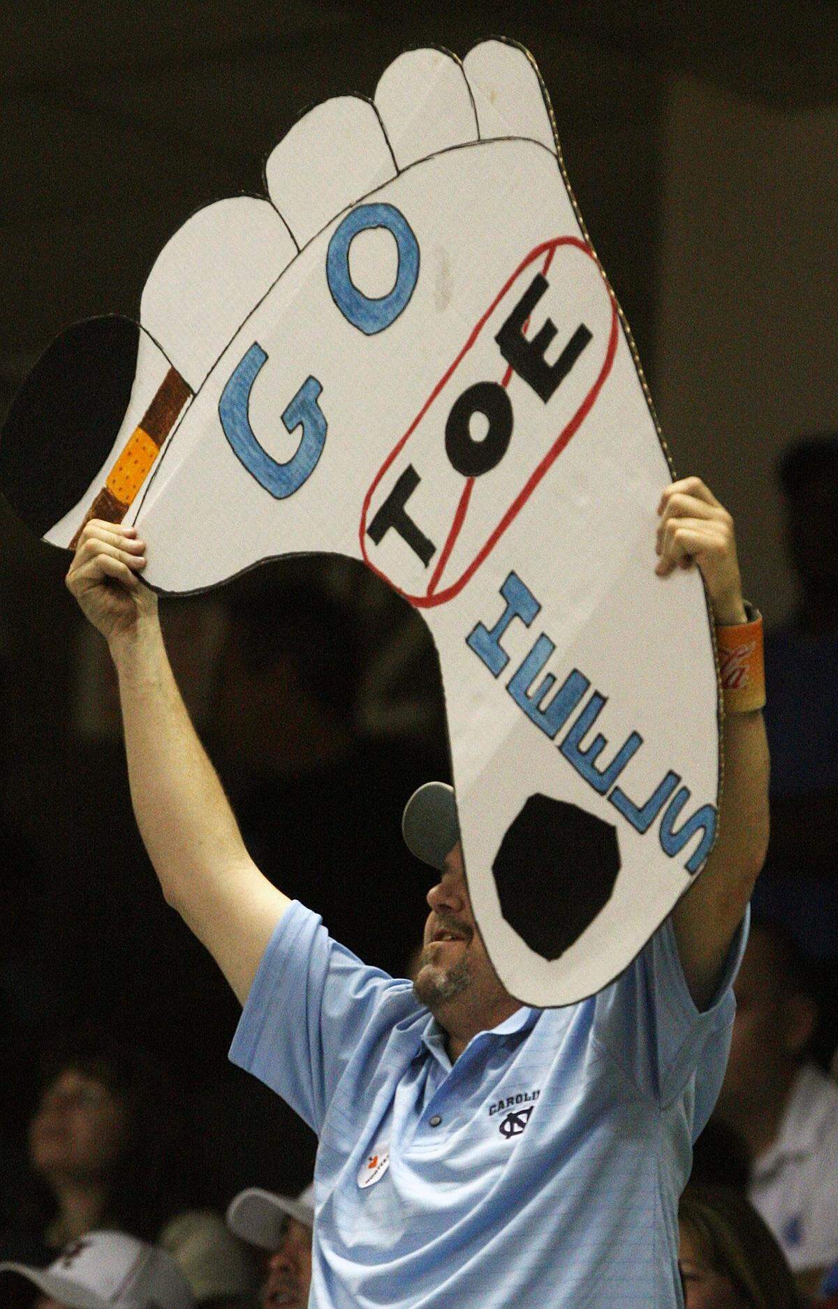 A Tar Heel fan holds up a foot with a bandaged big toe as Ty Lawson is introduced at the NCAA tournament in Greensboro,NC Saturday March 21, 2009.CHUCK LIDDY-chuck.liddy@newsobserver.com