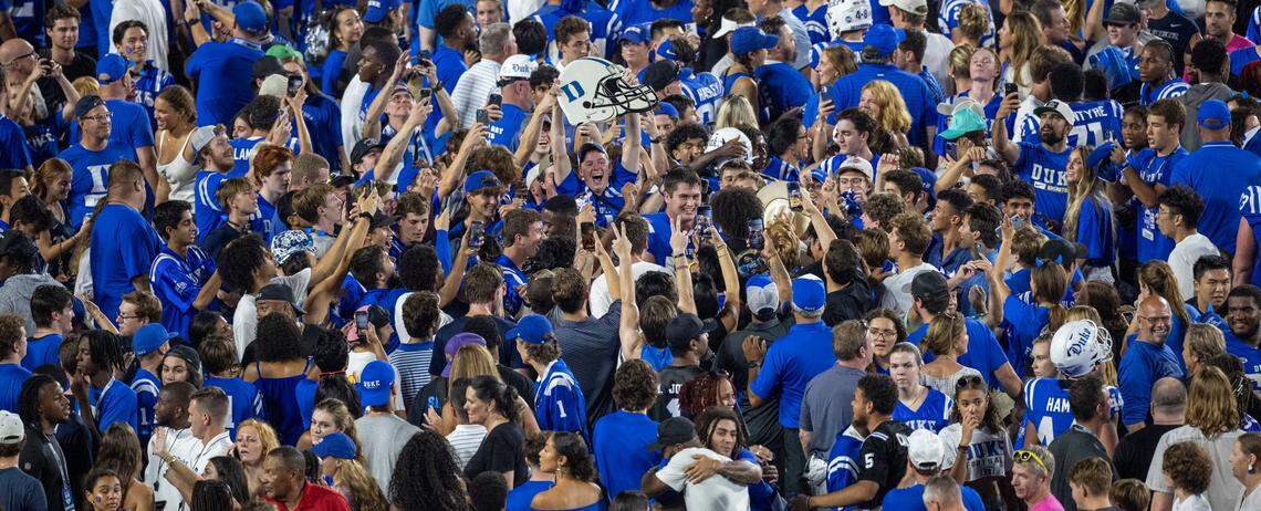 Duke fans storm the field to celebrate their 28-7 victory over Clemson on Monday, September 4, 2023 at Wallace Wade Stadium Stadium in Durham, N.C.