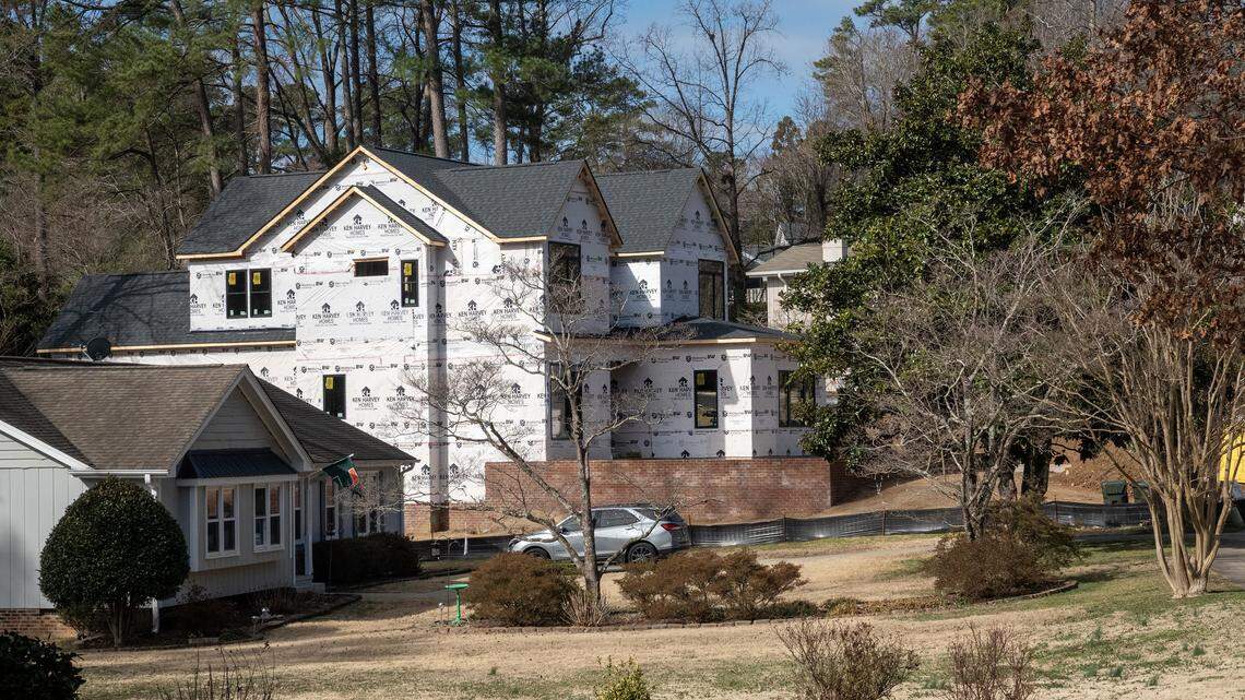 A home under construction on Ravenhurst Drive in Raleigh, NC looms over its neighbor, Feb. 23, 2026. This home has already been sold.