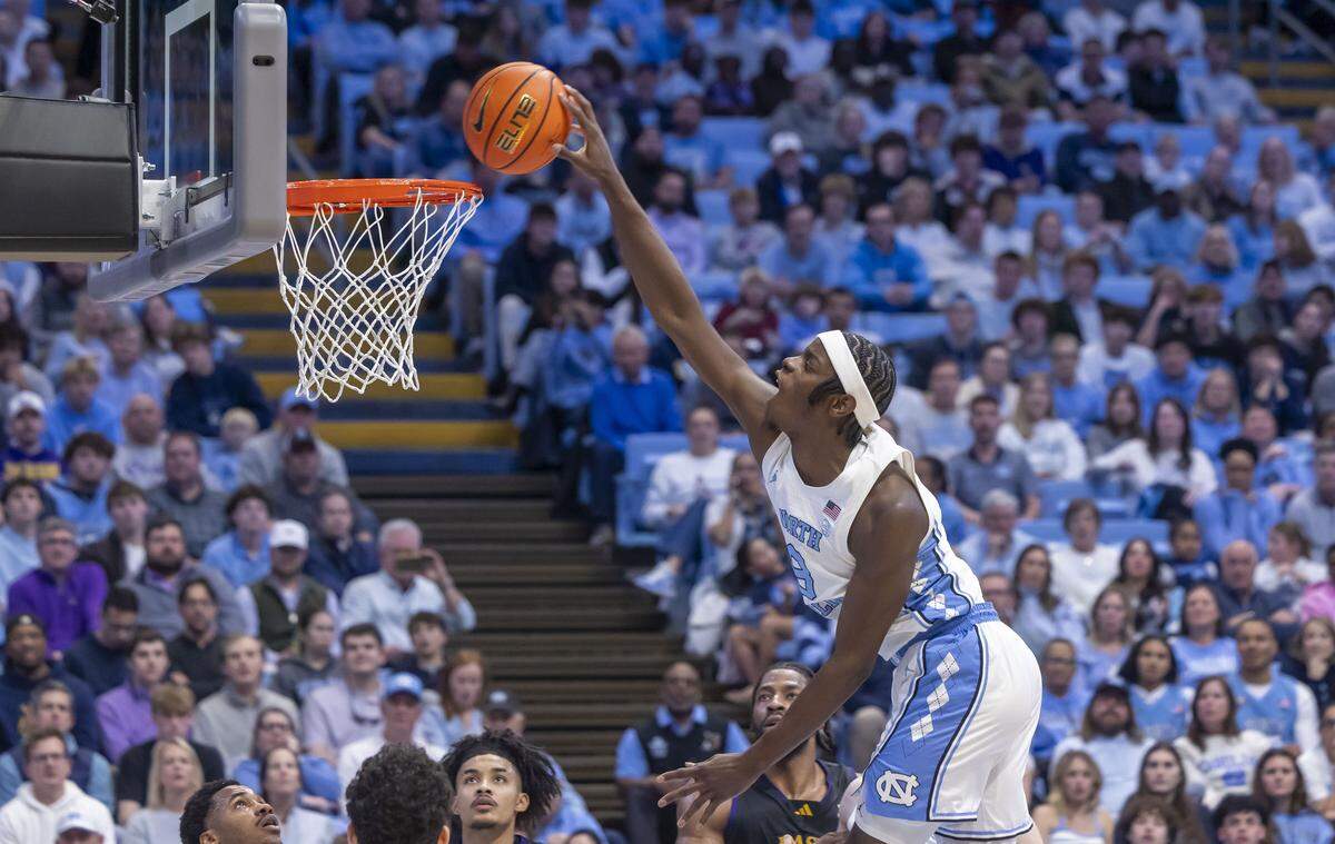 North Carolina forward Caleb Wilson (8) soars above the rim for a dunk in the second half against East Carolina on Monday, December 22, 2025 at the Smith Center in Chapel Hill, N.C. Wilson scored 21 points in the Tar Heels’ 99-51 victory. 