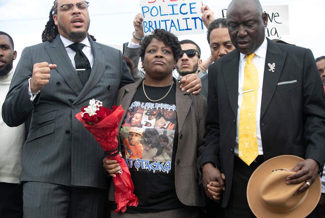 Rev. Greg Drumwright says a prayer moments before Sonya Williams laid a bouquet of flowers on a memorial for her son Darryl Williams on Rock Quarry Road on Thursday, February 16, 2023 in Raleigh, N.C. Williams died after being tased by Raleigh police in January.