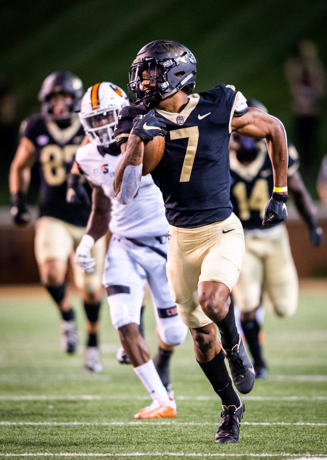 Wake Forest freshman wide receiver Donavon Greene (7) returns a kickoff for a touchdown on Friday, Oct. 2, 2020 at Truist Field in Winston-Salem, N.C. (Winston-Salem Journal/Andrew Dye) 100320-wsj-spt-wakefootball