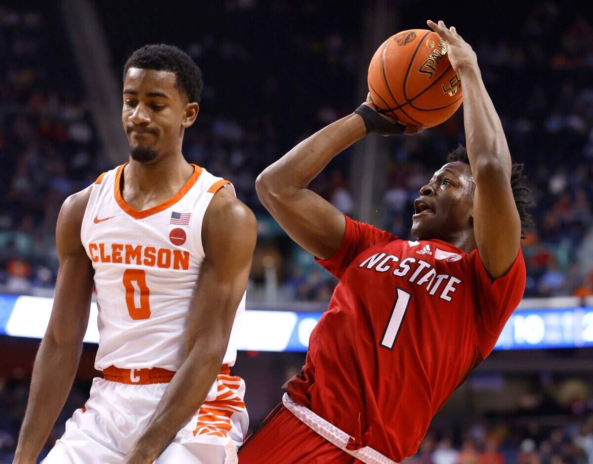 N.C. State’s Jarkel Joiner (1) shoots after being fouled vy Clemson’s Joshua Beadle (0) during the first half of N.C. State’s game against Clemson in the quarterfinals of the ACC Men’s Basketball Tournament in Greensboro, N.C., Thursday, March 9, 2023.