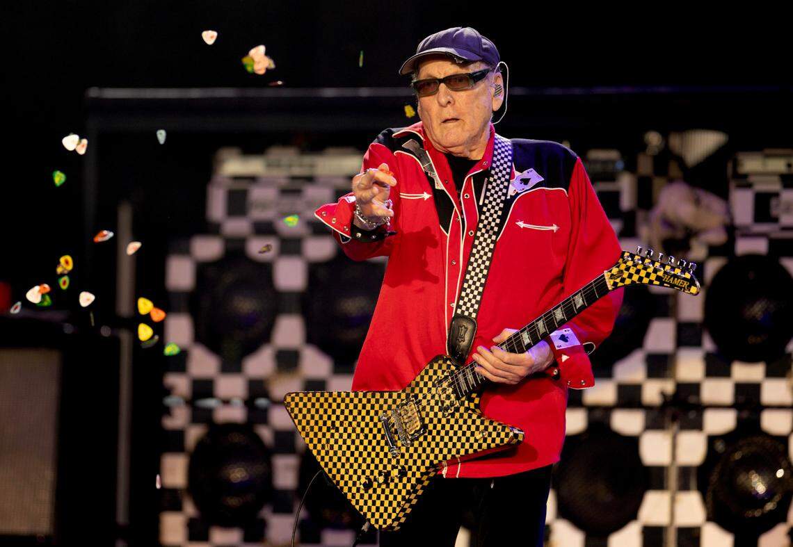 Cheap Trick’s Rick Nielsen tosses a handful of guitar picks into the crowd as the band opens for Rod Stewart Tuesday night, July 8, 2025 in Raleigh.