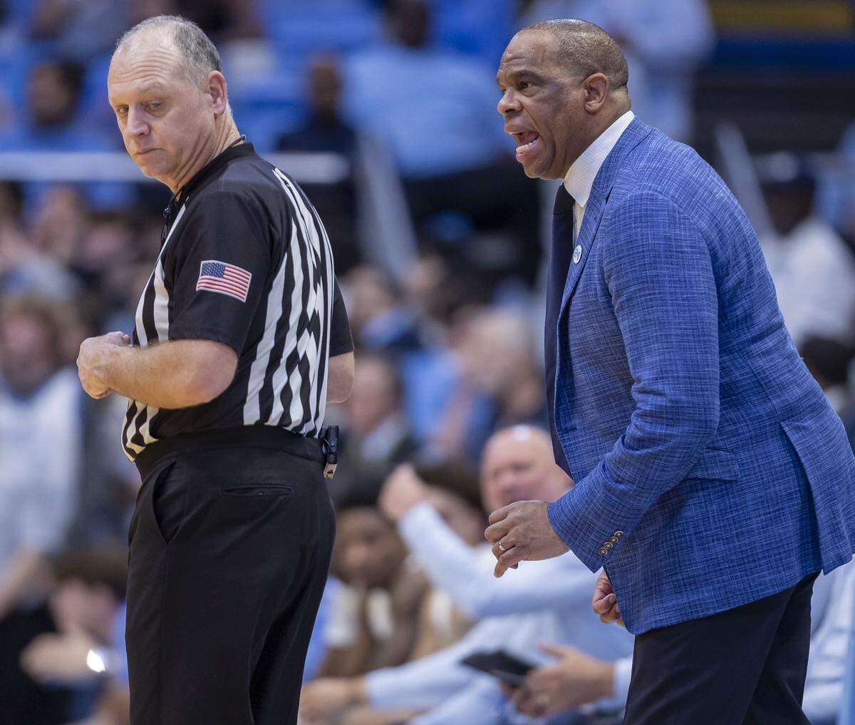 North Carolina coach Hubert Davis questions a call by the official Tim Clougherty, in the first half against Virginia Tech, on Saturday, February 28, 2026 at the Smith Center in Chapel Hill, N.C.