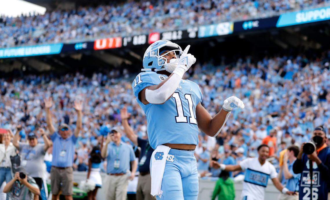 UNC wide receiver Josh Downs (11) celebrates after scoring on a 45-yard touchdown reception during the first half of North Carolinas game against Miami at Kenan Stadium in Chapel Hill, N.C., Saturday, October 16, 2021.