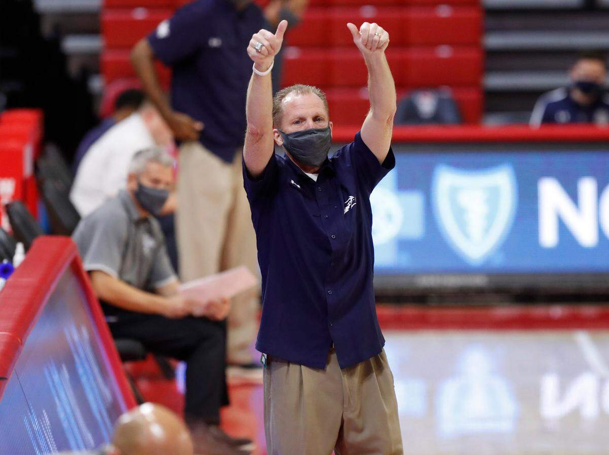North Florida’s head coach Matthew Driscoll gives N.C. State players a thumbs up after N.C. State’s 86-51 victory over North Florida in the Mako Medical Wolfpack Invitational at Reynolds Coliseum in Raleigh, N.C., Friday, Nov. 27, 2020.