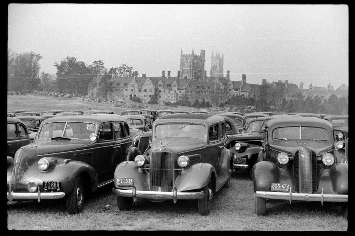 Cars packed the parking lot around the football stadium on the Duke campus for the sold-out Duke-Carolina game in 1939. Duke Chapel is visible in the distance along with other Gothic-architecture buildings on the campus.