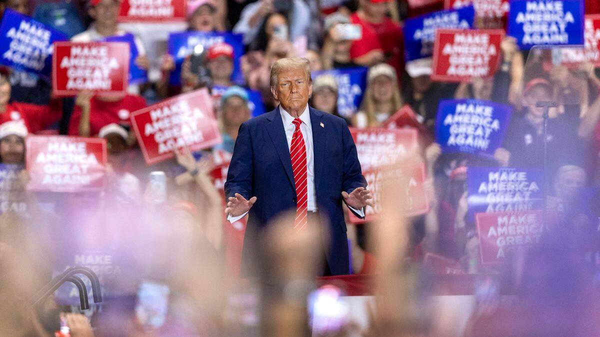 Donald Trump, then the Republican presidential nominee, soaks up applause from his supporters as he arrives for a rally on Wednesday, October 30, 2024 at the Rocky Mount Event Center in Rocky Mount, N.C.
