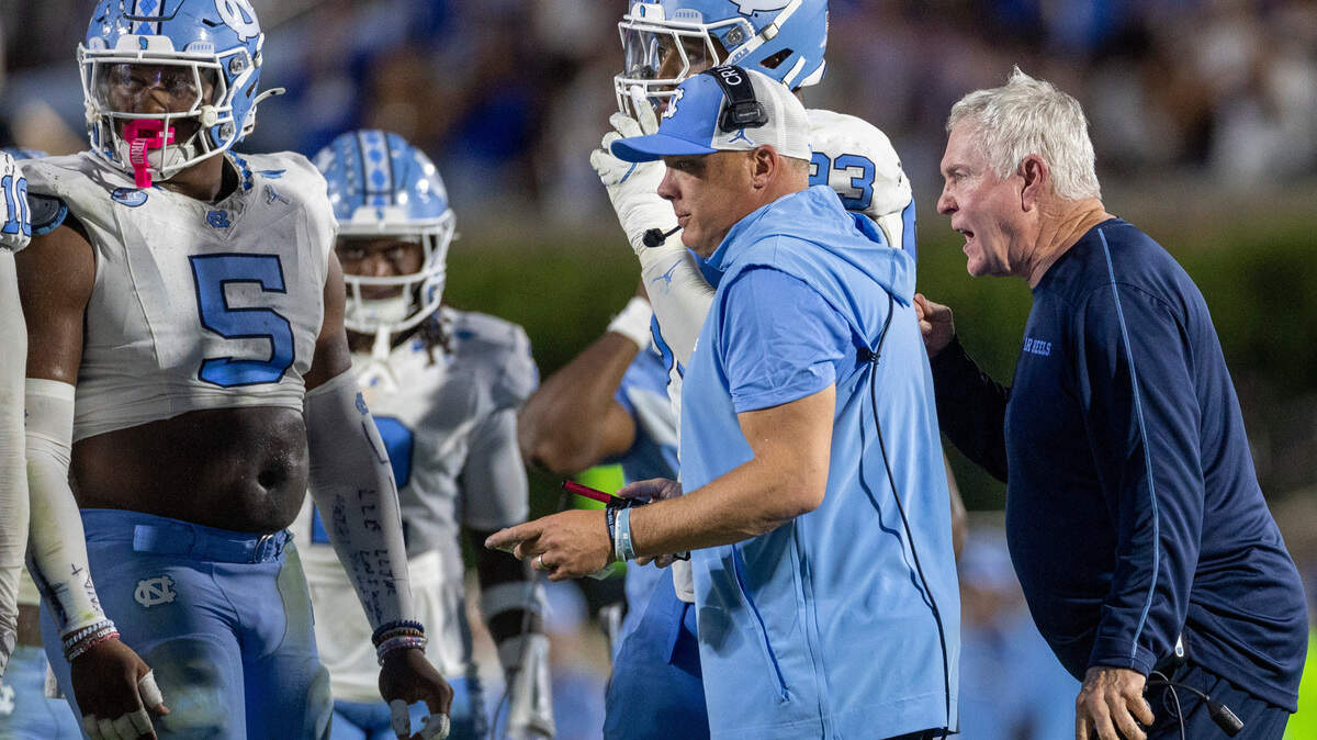 North Carolina coach Mack Brown has a few words with the defensive unit, behind defensive coordinator Geoff Collins, after the Blue Devils secure their 21-20 lead over the Tar Heels in the fourth quarter on Saturday, September 28, 2024 at Wallace Wade Stadium in Durham, N.C.