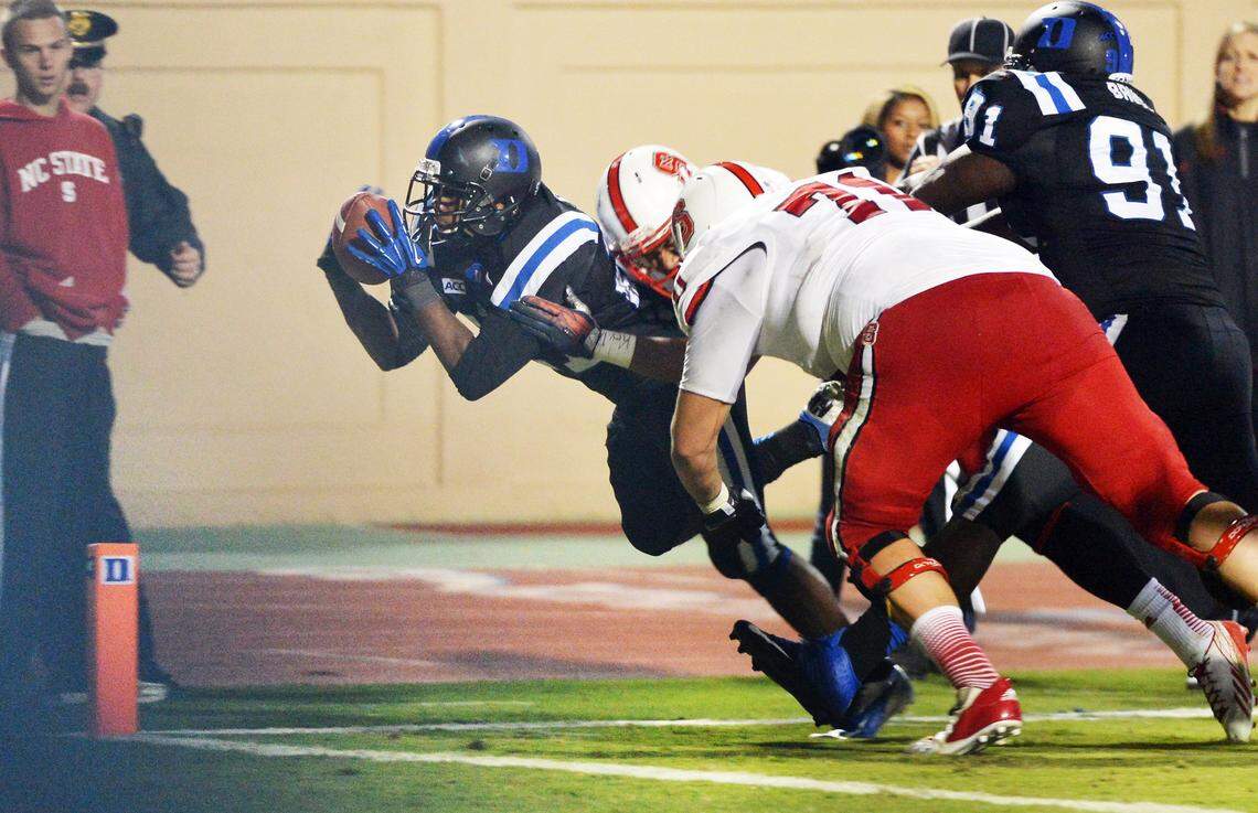 Duke cornerback DeVon Edwards dives in to score one of his three second half touchdowns after intercepting a pass in the fourth quarter.