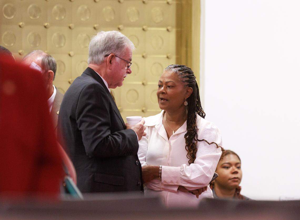 Rep. Donny Lambeth, a Republican from Forsyth, speaks with Rep. Carla Cunningham, a Democrat from Mecklenburg, prior to a session in the House chamber of the Legislative Building on Wednesday, May 21, 2025, in Raleigh, N.C.