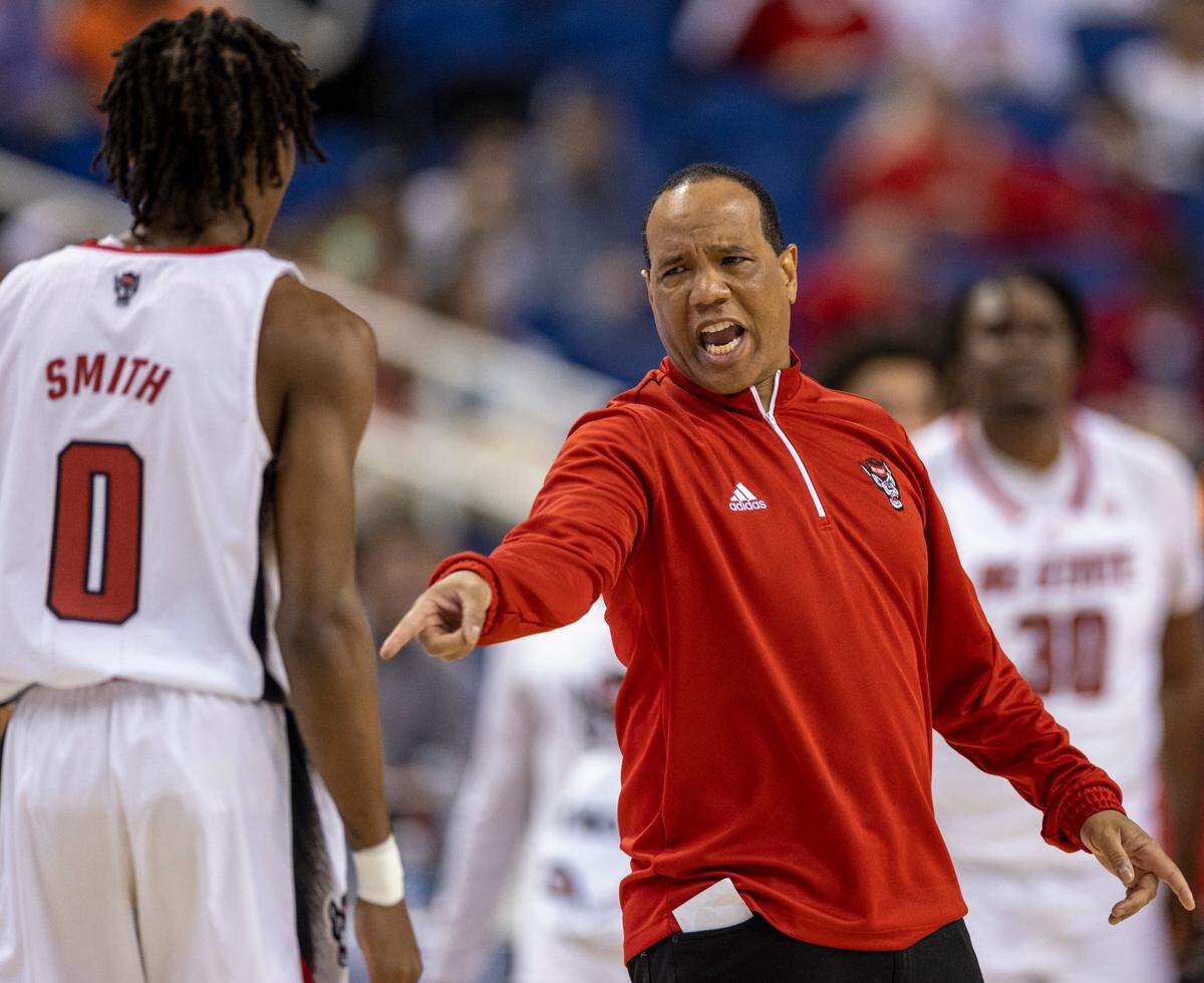 N.C. State coach Kevin Keatts has a word with Terquavion Smith (0) during a time out in the second half against Virginia Tech in the second round of the ACC Tournament on Wednesday, March 8, 2023 at the Greensboro Coliseum in Greensboro, N.C. Smith scored 30 in the Wolfpack’s 97-77 victory.
