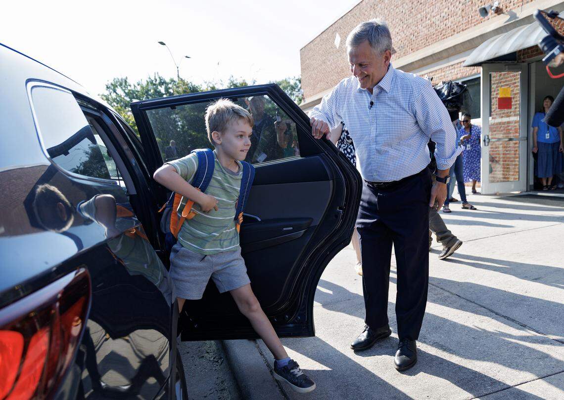 Gov. Josh Stein greets Yuri Gruehn, a third-grade student at Washington Elementary School, on the first day of school on Aug. 25, 2025, in Raleigh.