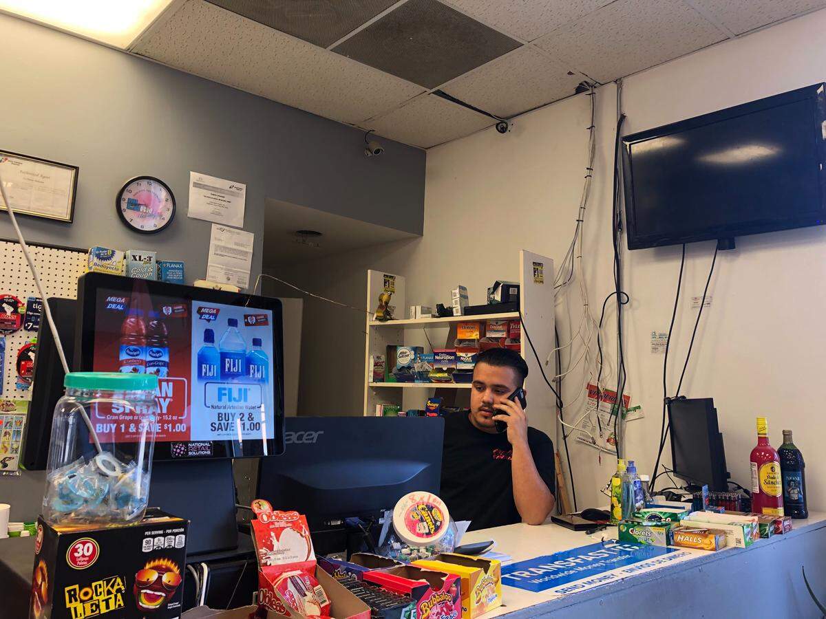 Juan Mendoza at work at La Nueva Mexicana. His grandparents used to operate the store.