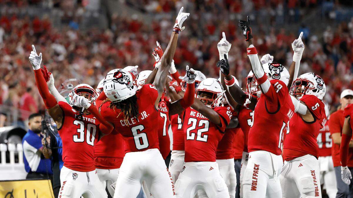N.C. State Corey Coley Jr. (6) and the defense celebrate after a Tennessee turnover in the first half of the Wolfpack’s game against Tennessee in the Duke’s Mayo Classic at Bank of America Stadium in Charlotte, N.C., Saturday, Sept. 7, 2024.