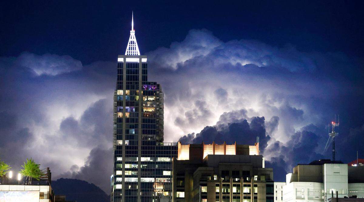 Storms light up the sky east of downtown Raleigh, N.C., Friday evening, April 28, 2023.
