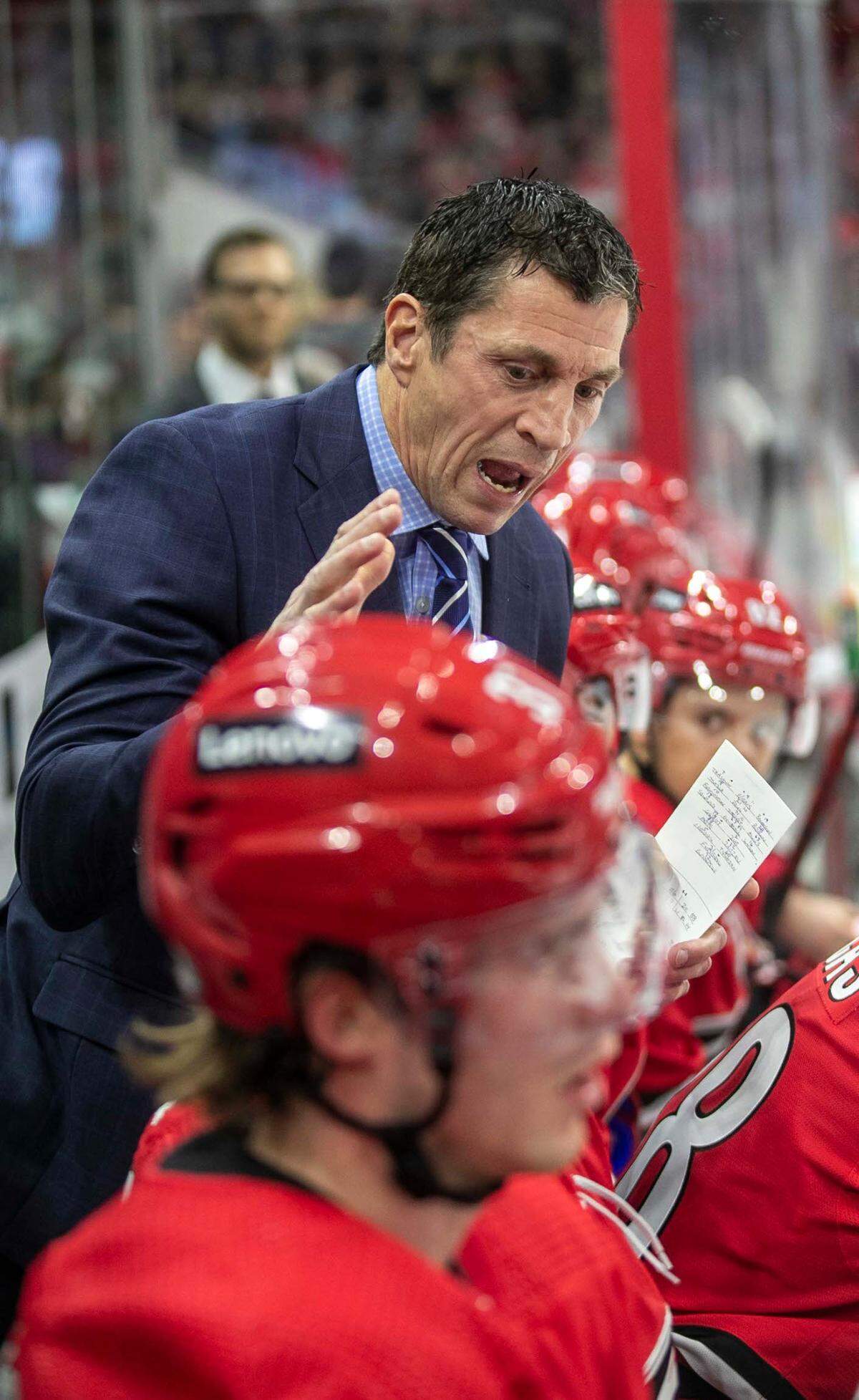 Carolina Hurricanes coach Rod Brind’Amour talks with his players during a time-out in the second period against the Ottawa Senators on Thursday, December 2, 2021 at PNC Arena in Raleigh, N.C.