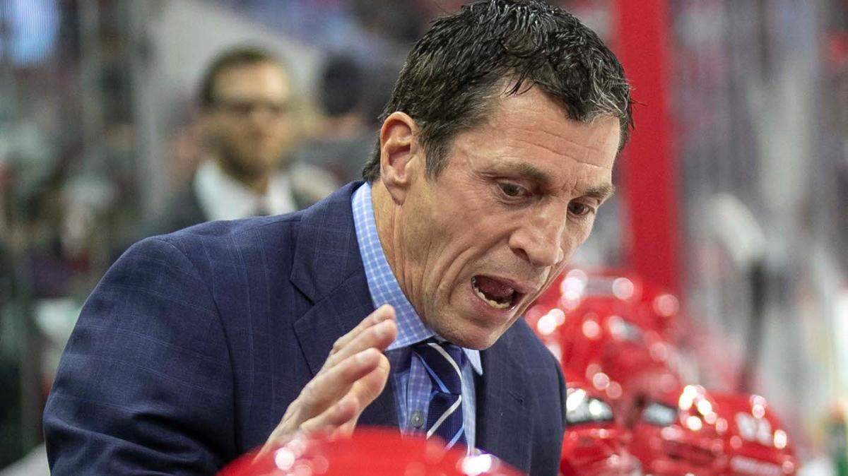 Carolina Hurricanes coach Rod Brind’Amour talks with his players during a time-out in the second period against the Ottawa Senators on Thursday, December 2, 2021 at PNC Arena in Raleigh, N.C.