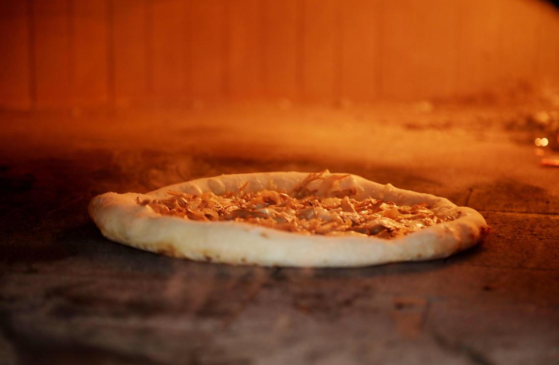 Poole’side Pies is built around Neapolitan-inspired pizzas, cranked out of the restaurant’s 800 degree wood-fire oven, which cooks two-day fermented dough in about 90 seconds.