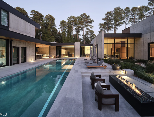 Built in 2022, the home sits on 1.02 acres and includes a 5,851-square-foot “main house” with seven bedrooms and seven and a half bathrooms.