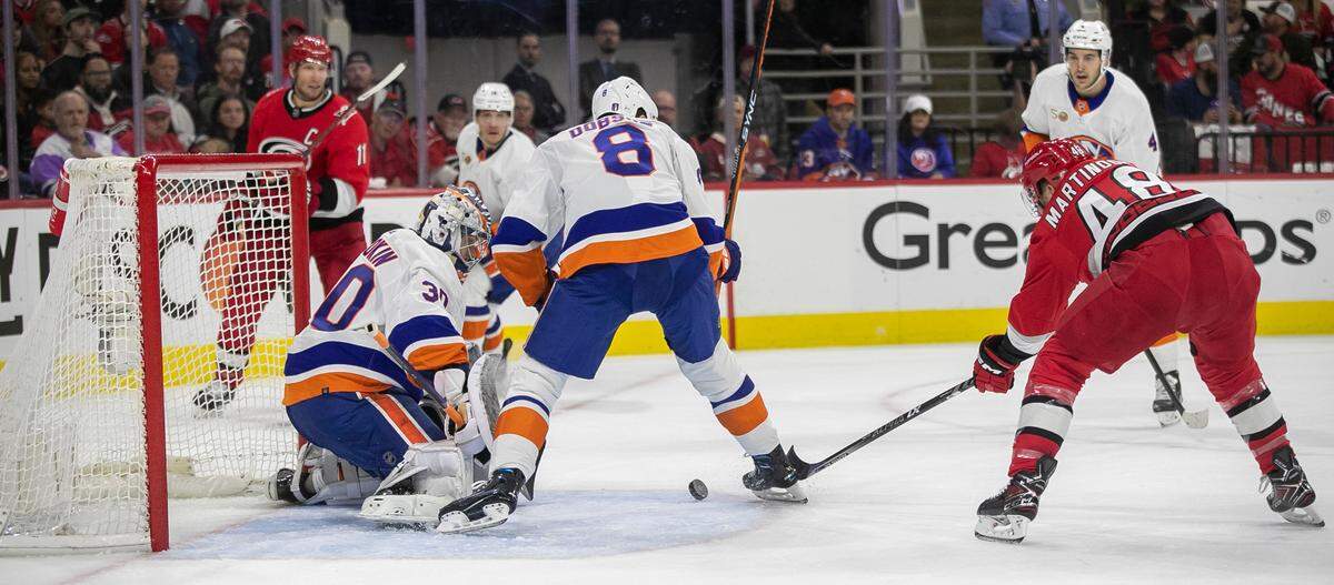 Carolina Hurricanes’ Jordan Martinook (48) works for a scoring attempt on New York Islanders’ goalie Ilya Sorokin (30) during game two of their Stanley Cup series on Wednesday, April 19, 2023 at PNC Arena in Raleigh, N.C.