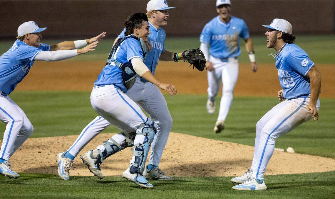 North Carolina’s infielder Jackson Van De Brake (8), catcher Luke Stevenson (44), first baseman Parks Harber and closing pitcher Dalton Pence (49) celebrate after the final out and their 2-1 victory over West Virginia, clinching the Super Regional and advancing to the College World Series on Saturday, June 8, 2024 at Boshamer Stadium in Chapel Hill, N.C.