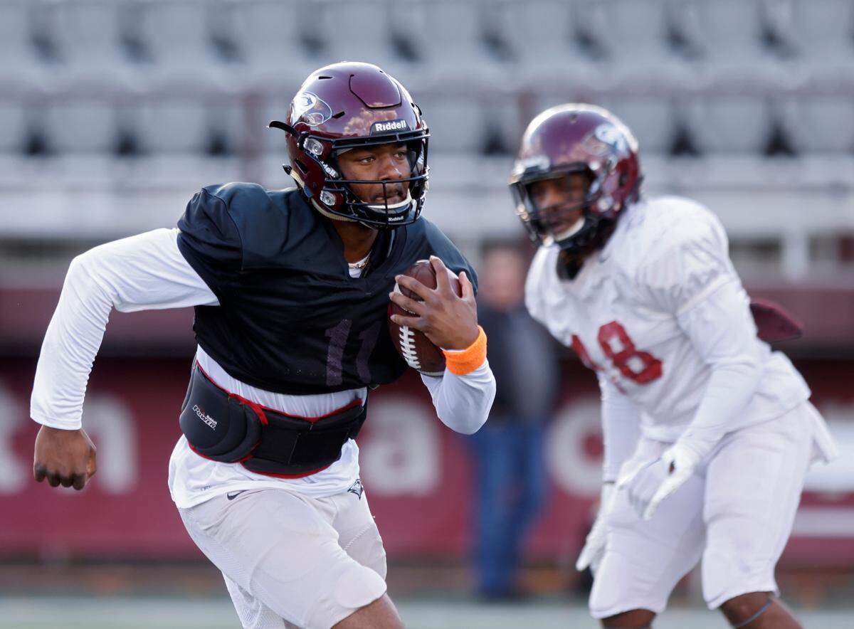 North Carolina Central quarterback Davius Richard runs the ball during practice at O’Kelly-Riddick Stadium on Tuesday, Oct. 18, 2022, in Durham, N.C.