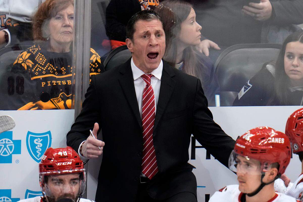 Carolina Hurricanes head coach Rod Brind’Amour makes his point to a referee during the third period of an NHL hockey game against the Pittsburgh Penguins in Pittsburgh, Thursday, Dec. 22, 2022. The Hurricanes won in overtime 4-3. (AP Photo/Gene J. Puskar)