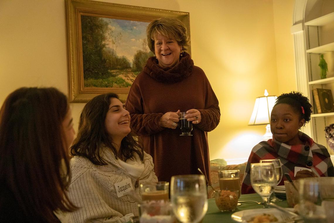 Meredith College president Jo Allen talks with students who attended an annual Thanksgiving lunch hosted at the president’s home for students who stay on campus for the holiday, on Wednesday, 27, 2019, in Raleigh, NC.