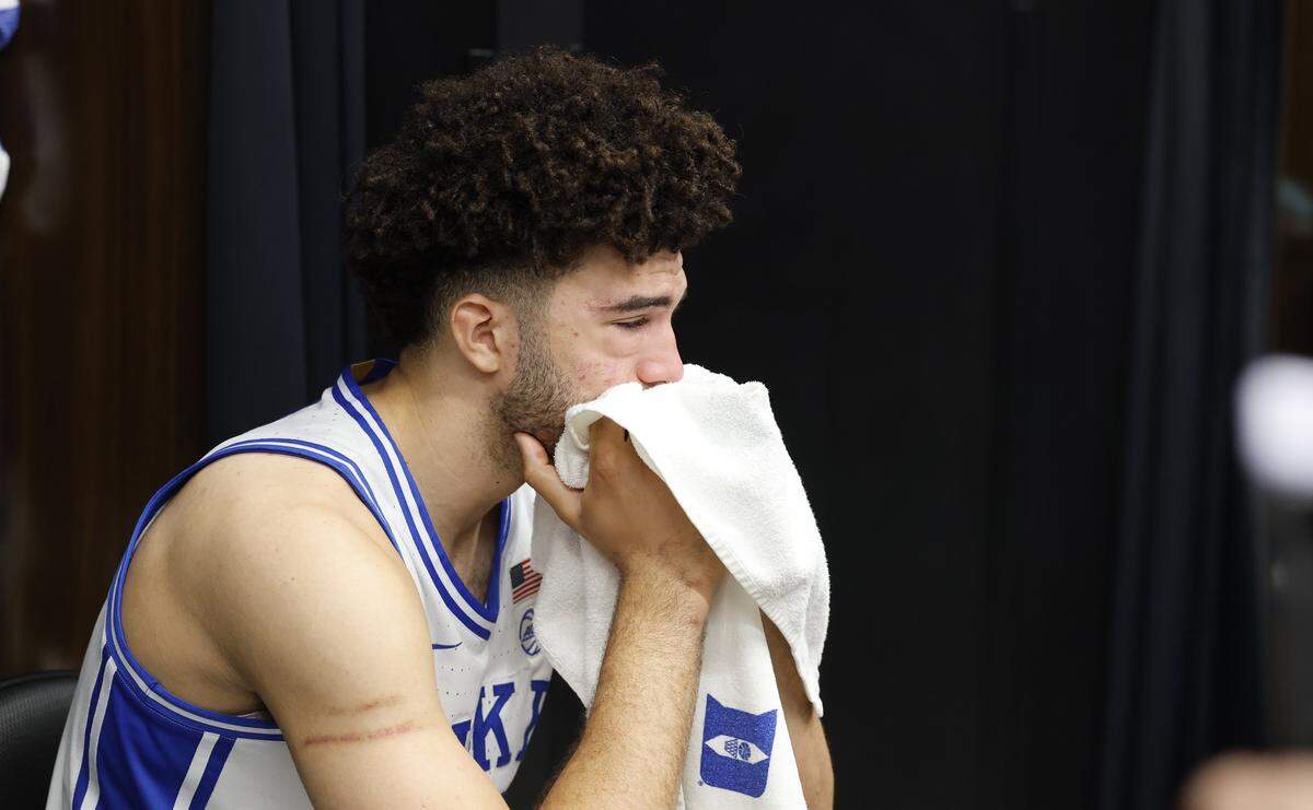 Duke’s Cameron Boozer sits in the locker room after UConn’s 73-72 victory over Duke in the NCAA Men’s Tournament East Regional Final at Capital One Arena in Washington, D.C., Sunday, March 29, 2026.