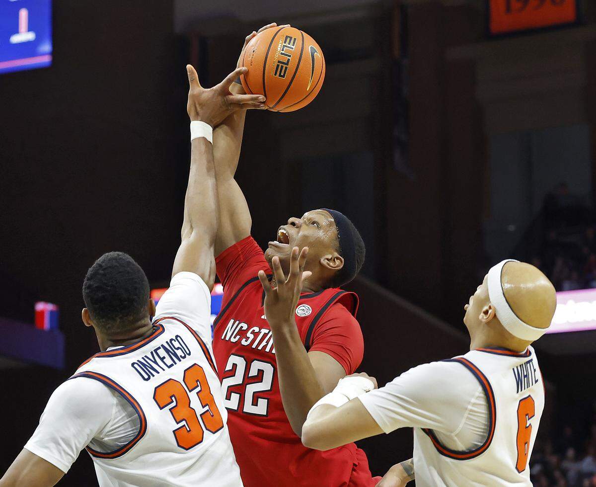 N.C. State's Ven-Allen Lubin grabs a rebound over Virginia's Ugonna Onyenso during the first half of the Wolfpack’s 90-61 loss on Thursday, Feb. 24, 2026, at John Paul Jones Arena in Charlottesville, Va. 